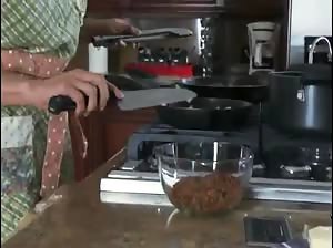 Sexy MILF cooking naked