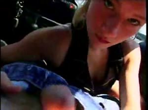 Cute amateur gives a blowjob in a car